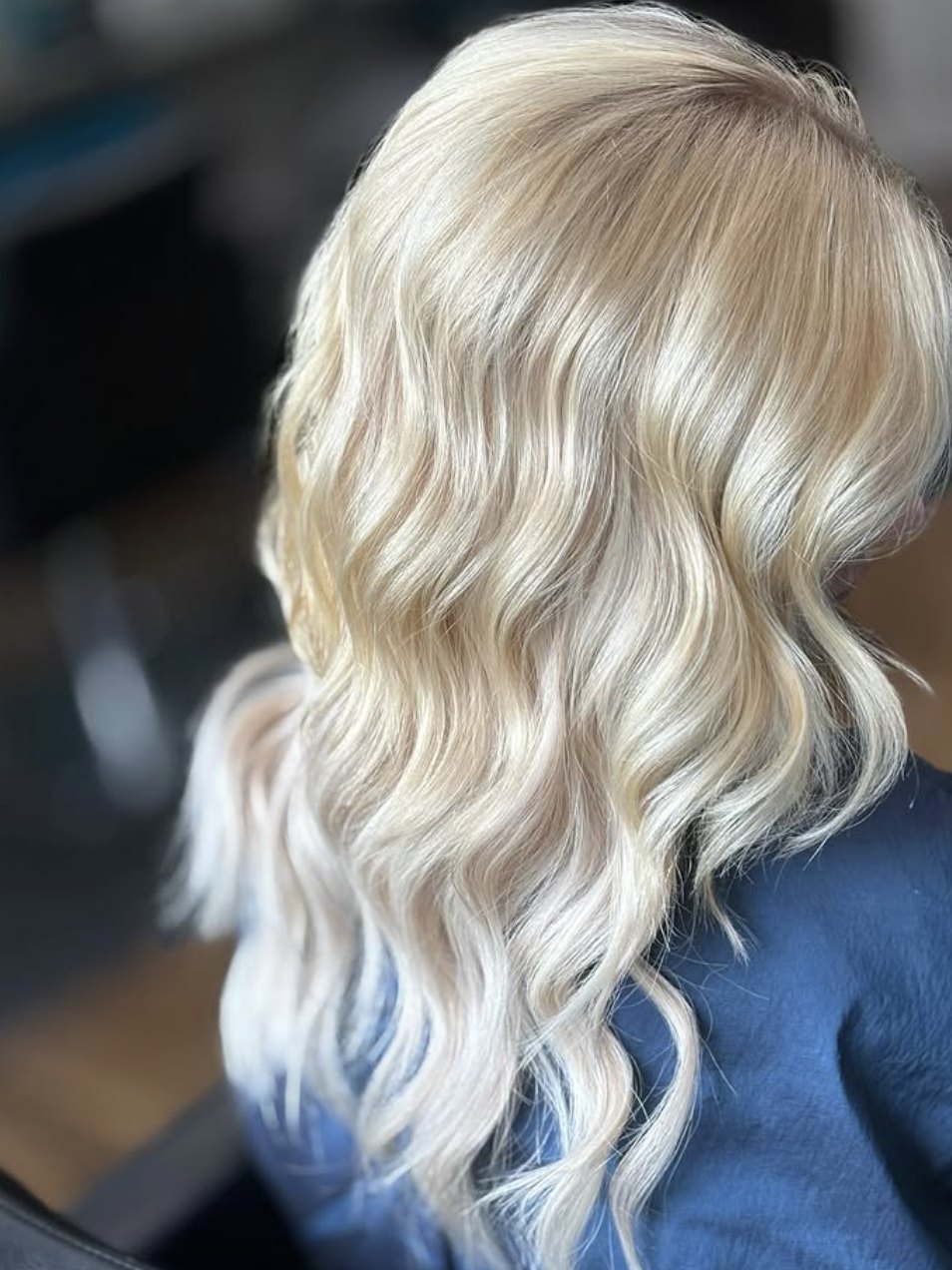 Bright blonde extensions with waves at Elevate Salon + Spa, Charlottesville VA