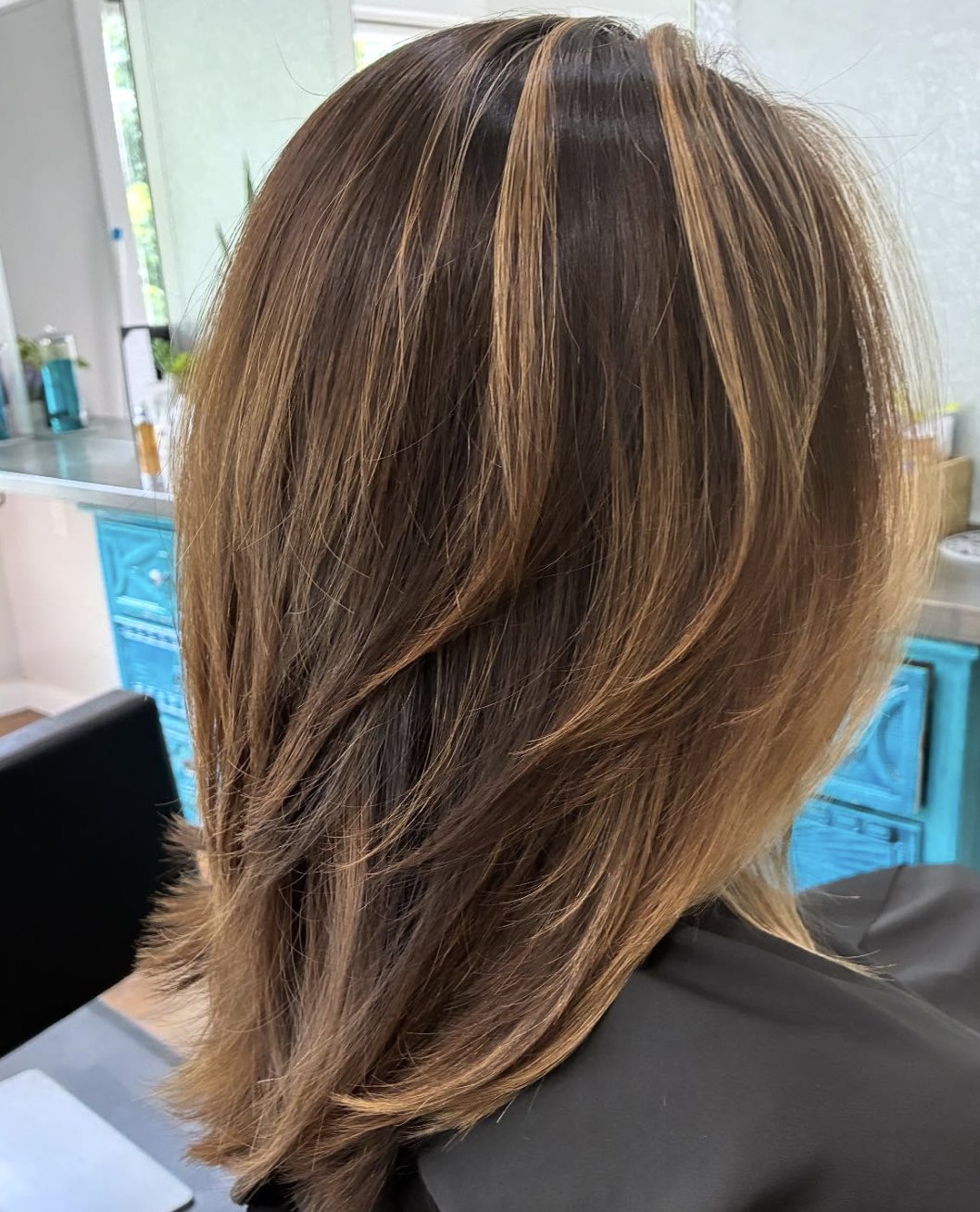 Brunette with caramel highlights at Elevate Salon + Spa, Charlottesville VA