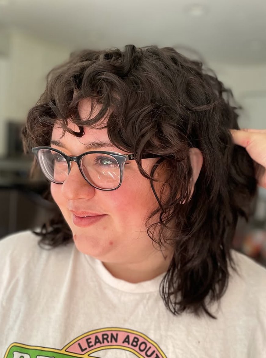 Dark curly shag with bangs at Elevate Salon + Spa, Charlottesville VA