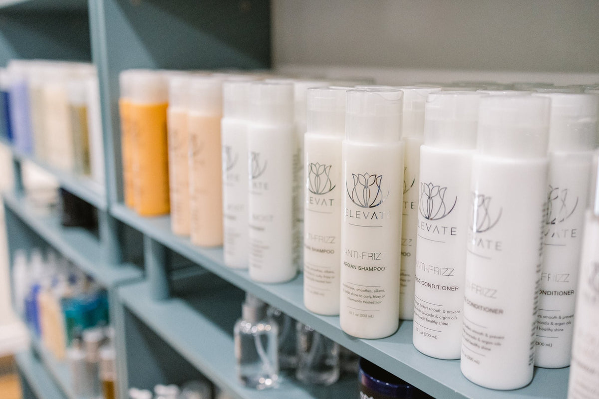 Elevate retail shelf of hair care at Elevate Salon + Spa, Charlottesville VA