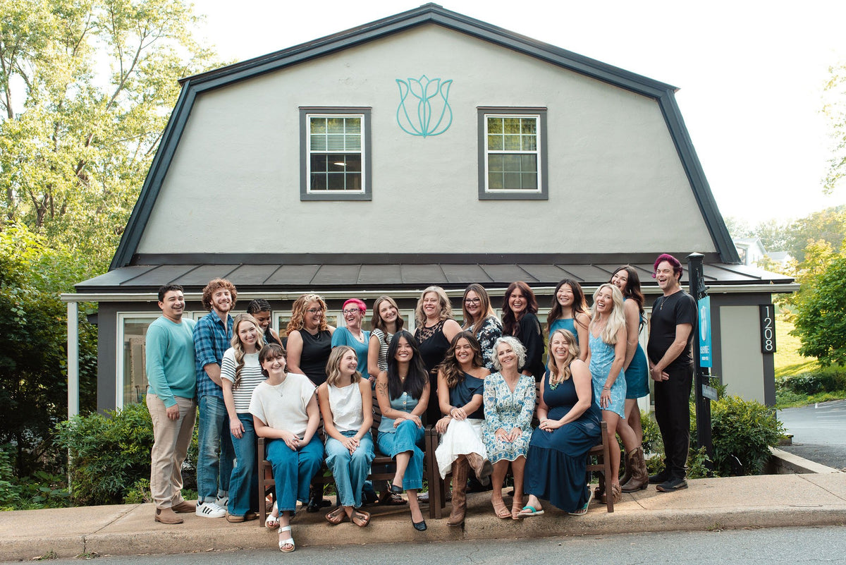 Elevate team group photo in front of the salon at Elevate Salon + Spa, Charlottesville VA