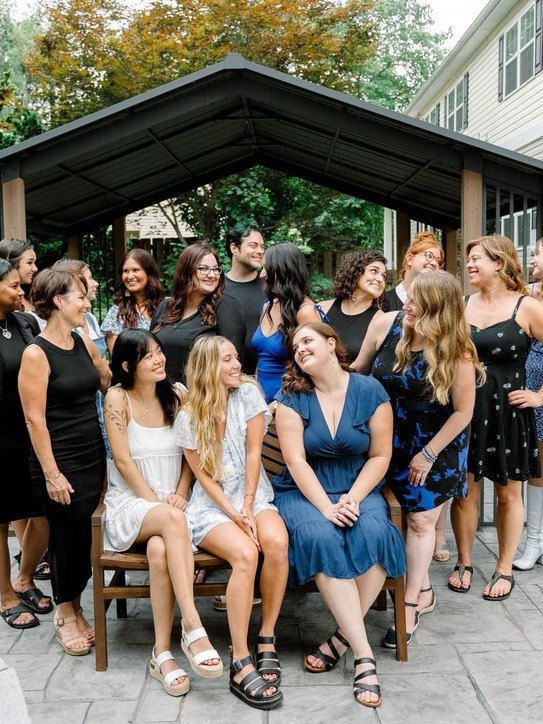 Elevate team group photo in the garden pavilion at Elevate Salon + Spa, Charlottesville VA