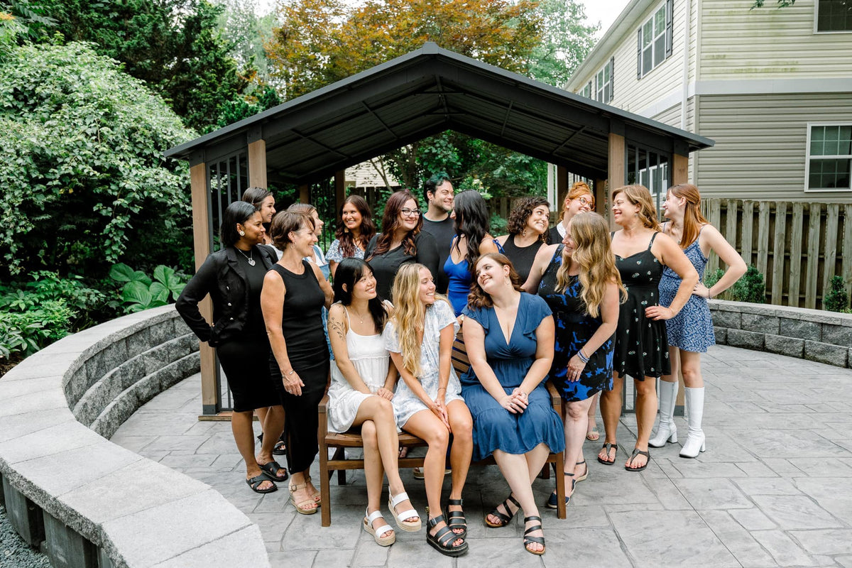 Elevate team group photo in the garden pavilion at Elevate Salon + Spa, Charlottesville VA