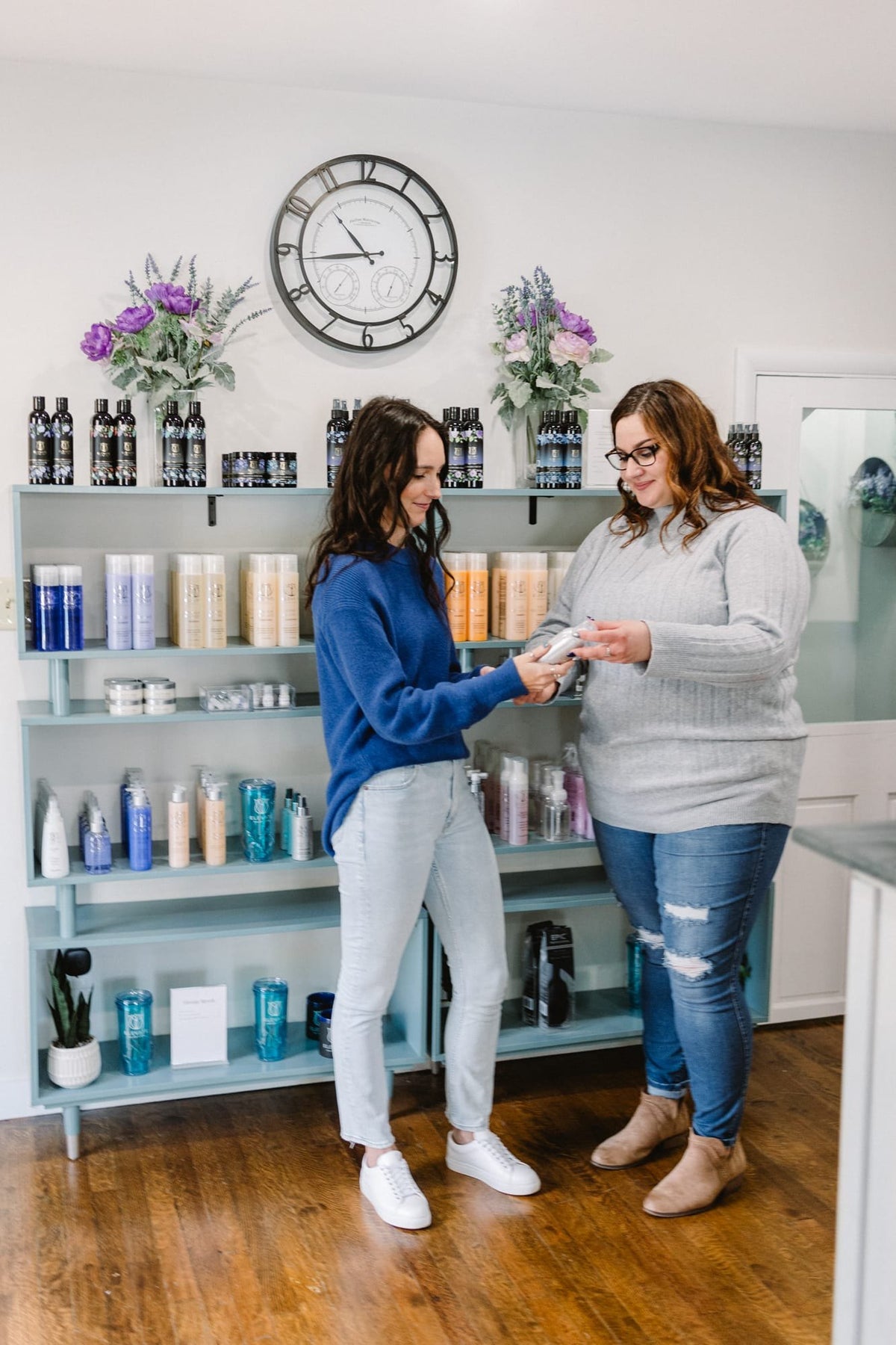 Front desk team welcoming a guest at Elevate Salon + Spa, Charlottesville VA