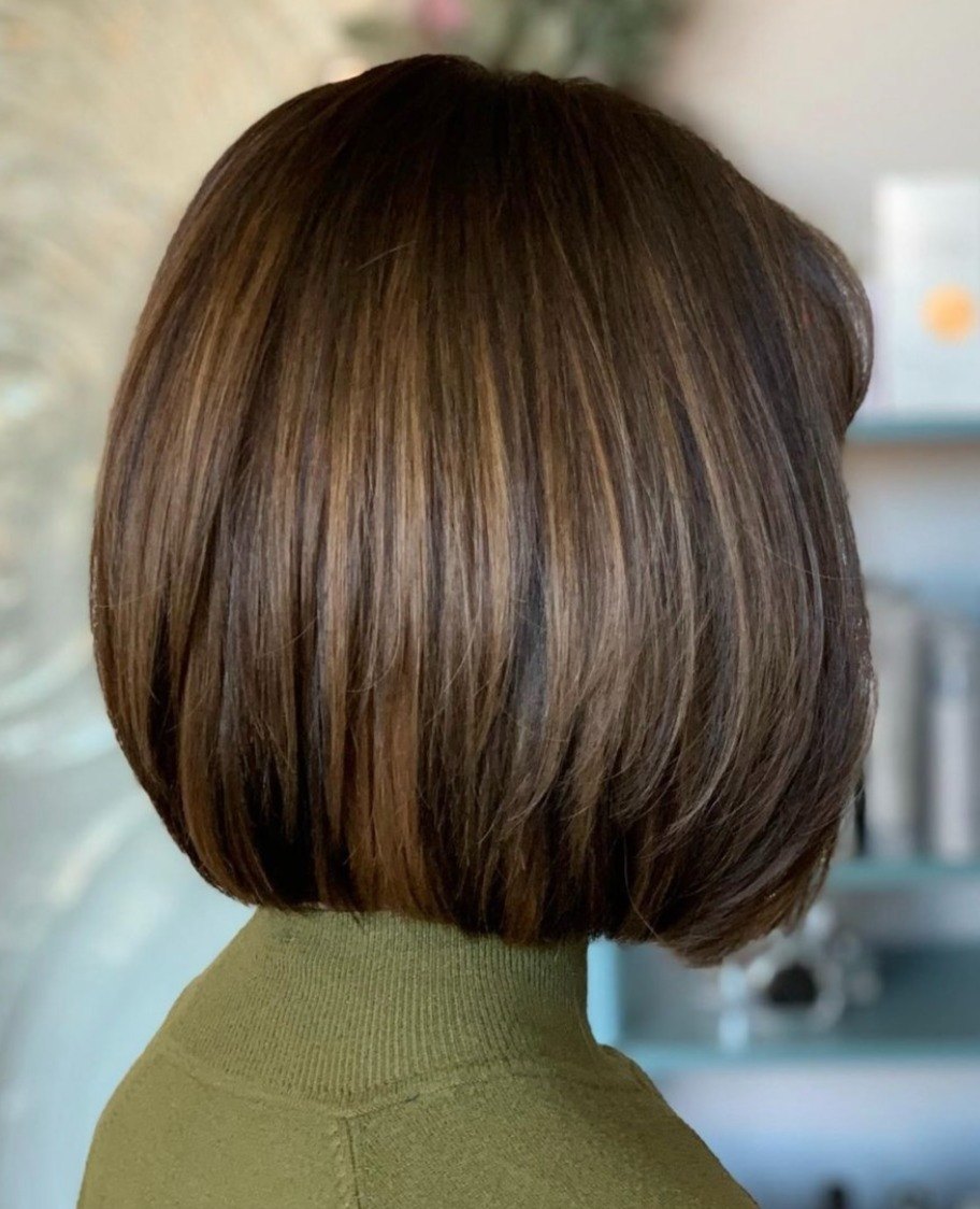 Glossy brunette bob with highlights at Elevate Salon + Spa, Charlottesville VA