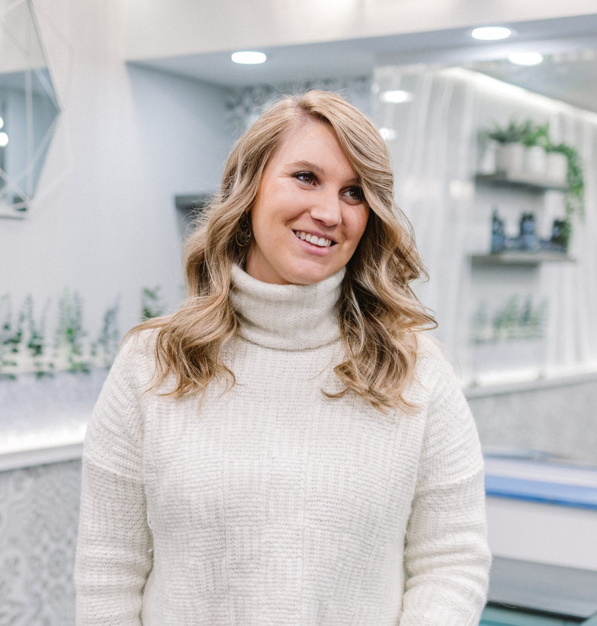Guest with soft blonde waves at Elevate Salon + Spa, Charlottesville VA