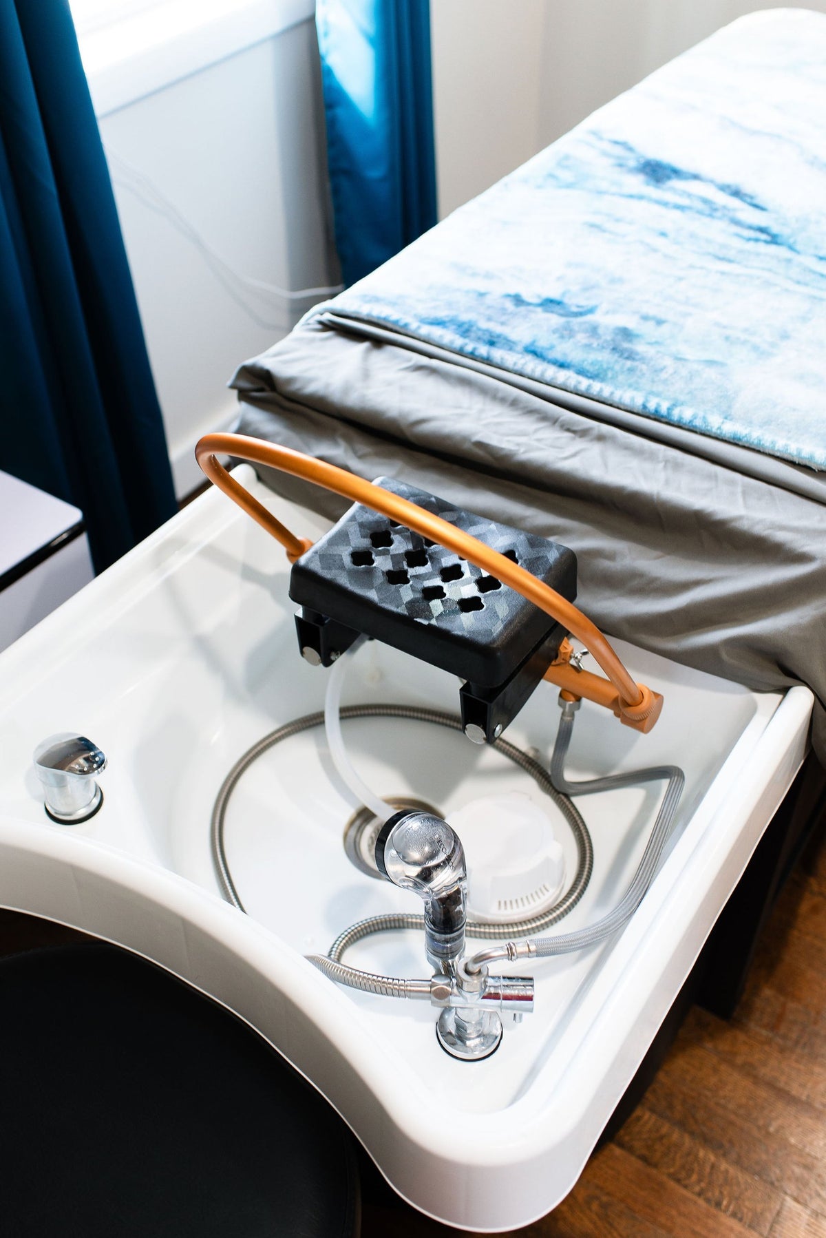 Head spa basin and treatment bed at Elevate Salon + Spa, Charlottesville VA