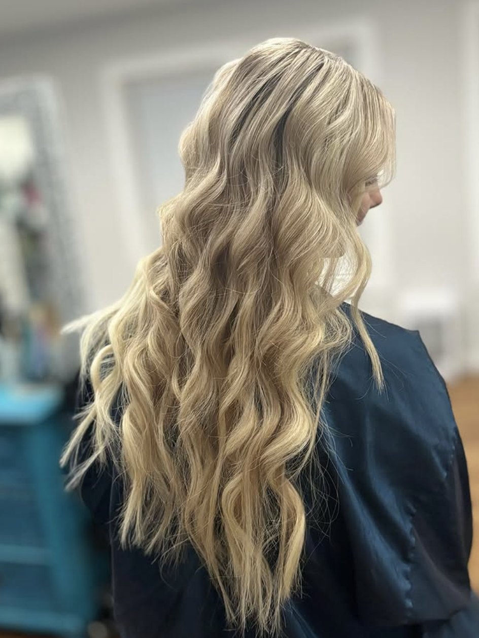 Long blonde extensions in waves at Elevate Salon + Spa, Charlottesville VA