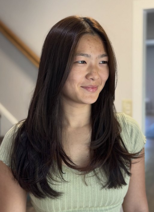 Long layered dark hair at Elevate Salon + Spa, Charlottesville VA