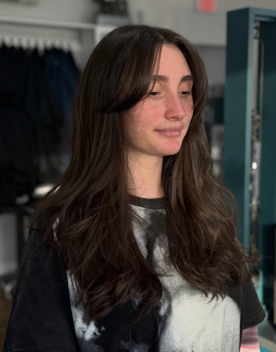 Long layers with curtain bangs at Elevate Salon + Spa, Charlottesville VA