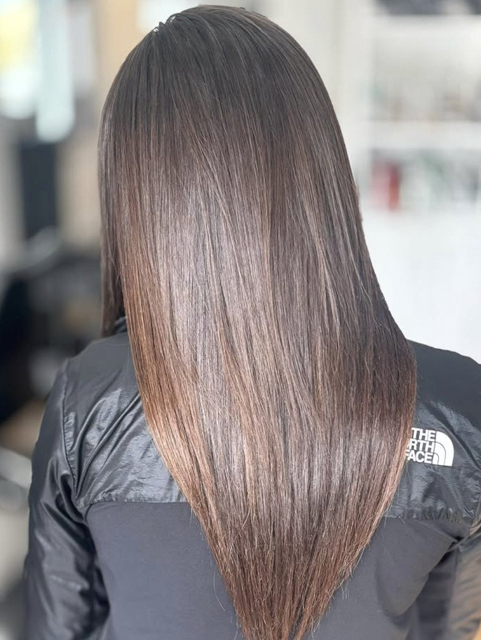 Sleek long brunette extensions at Elevate Salon + Spa, Charlottesville VA
