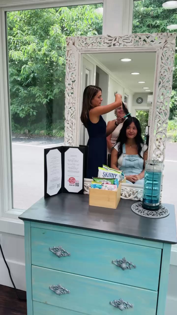 Styling station with mirror and snacks at Elevate Salon + Spa, Charlottesville VA