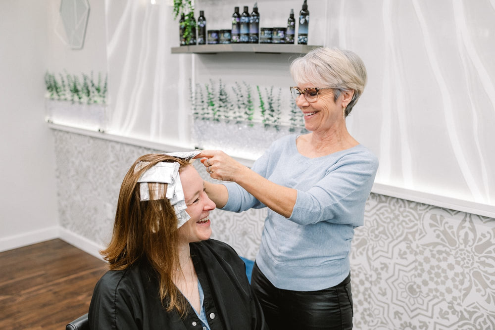 Stylist applying foils at Elevate Salon + Spa, Charlottesville VA