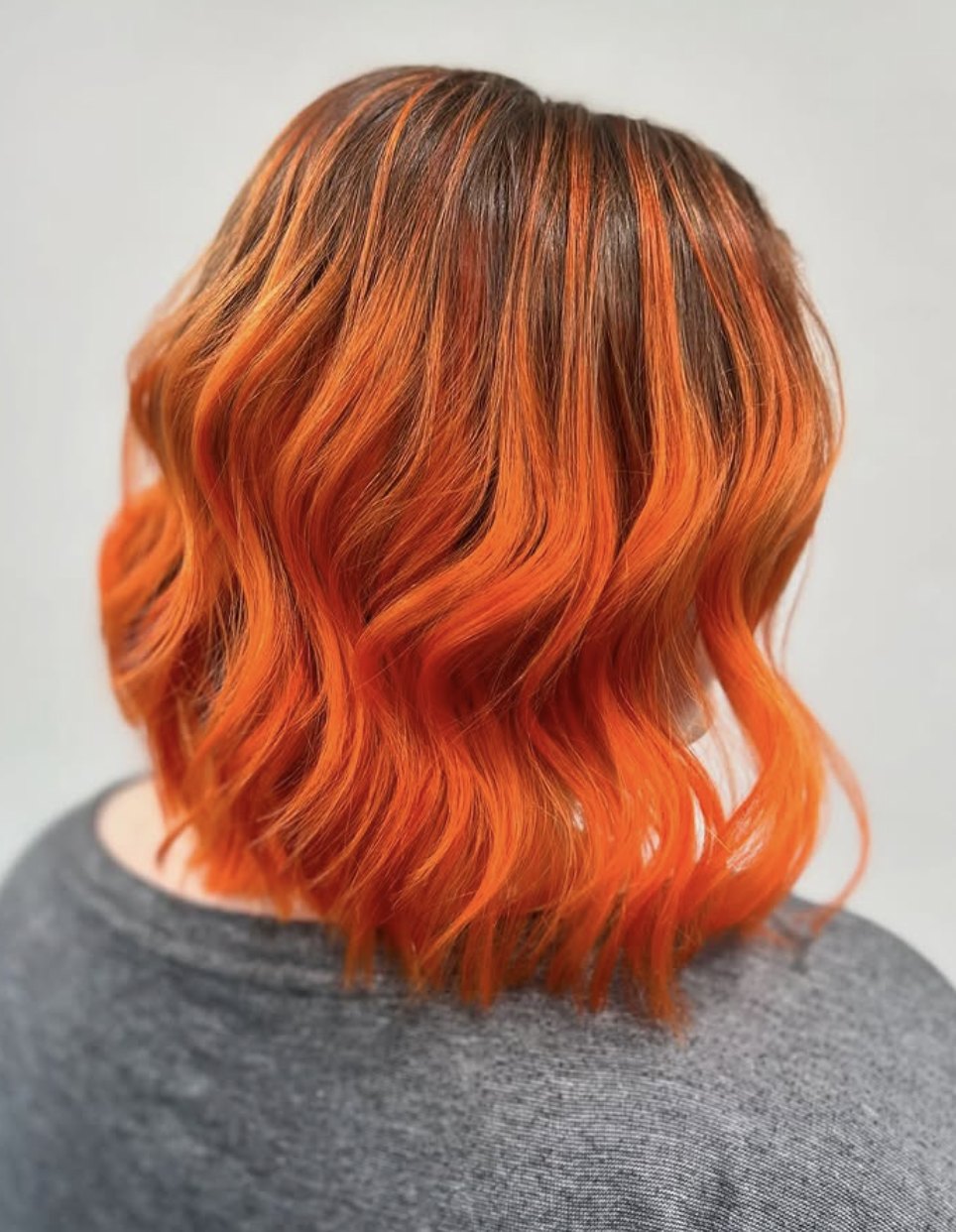 Vivid orange lob at Elevate Salon + Spa, Charlottesville VA