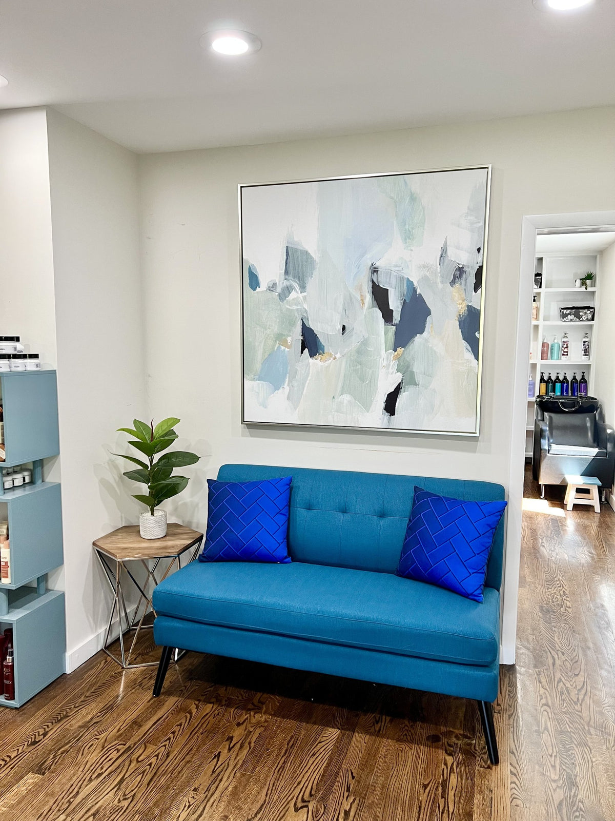 Waiting area with blue sofa at Elevate Salon + Spa, Charlottesville VA